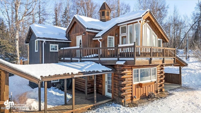 40327 S Malaspina Loop, Talkeetna, AK 99676 - snow covered property with a deck, log siding, and a chimney