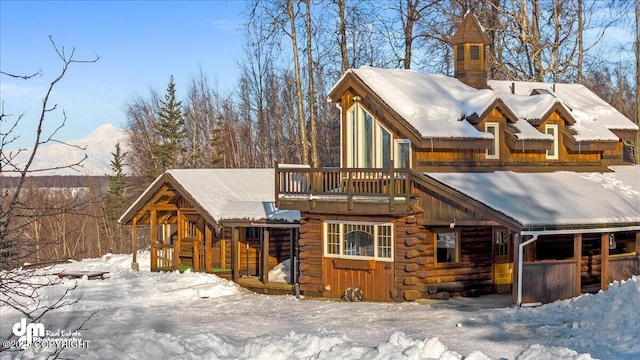 40327 S Malaspina Loop, Talkeetna, AK 99676 - snow covered rear of property featuring log siding