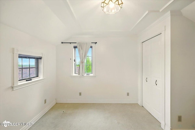40327 S Malaspina Loop, Talkeetna, AK 99676 - unfurnished bedroom with multiple windows, baseboards, a closet, light colored carpet, and ornamental molding