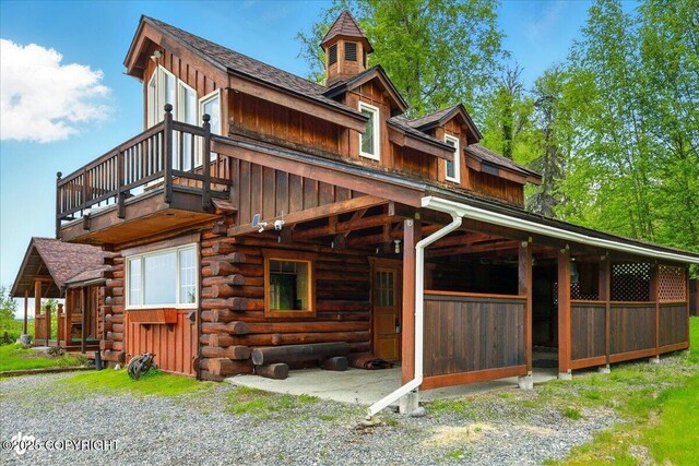 40327 S Malaspina Loop, Talkeetna, AK 99676 - view of side of home featuring board and batten siding, log exterior, and roof with shingles
