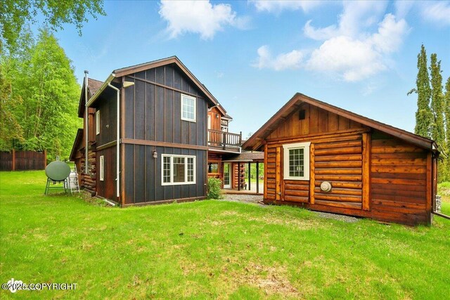 40327 S Malaspina Loop, Talkeetna, AK 99676 - back of house with board and batten siding and a yard