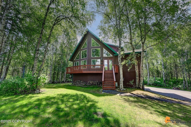7408 N Grouse Loop, Wasilla, AK 99654 - view of front facade with stairs, a deck, a front lawn, and french doors