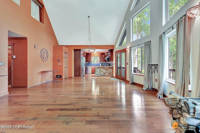 7408 N Grouse Loop, Wasilla, AK 99654 - living area with a high ceiling and light wood-style floors