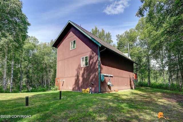 7408 N Grouse Loop, Wasilla, AK 99654 - view of side of home with a yard
