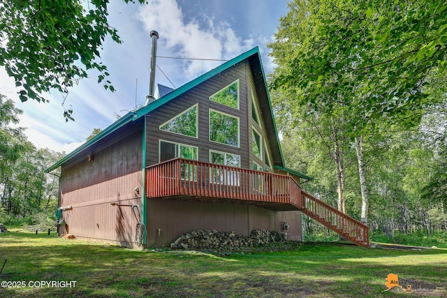 7408 N Grouse Loop, Wasilla, AK 99654 - rear view of property featuring stairway, a wooden deck, and a yard