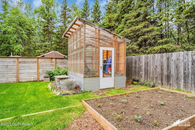 1601 Bannister Dr, Anchorage, AK 99508 - view of outbuilding featuring a garden
