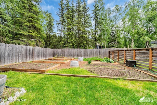 1601 Bannister Dr, Anchorage, AK 99508 - view of yard featuring a vegetable garden