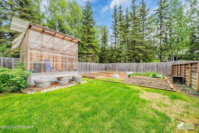 1601 Bannister Dr, Anchorage, AK 99508 - view of yard with a garden
