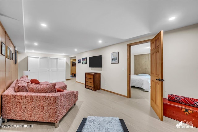 1601 Bannister Dr, Anchorage, AK 99508 - living area featuring light wood-style flooring, recessed lighting, and baseboards
