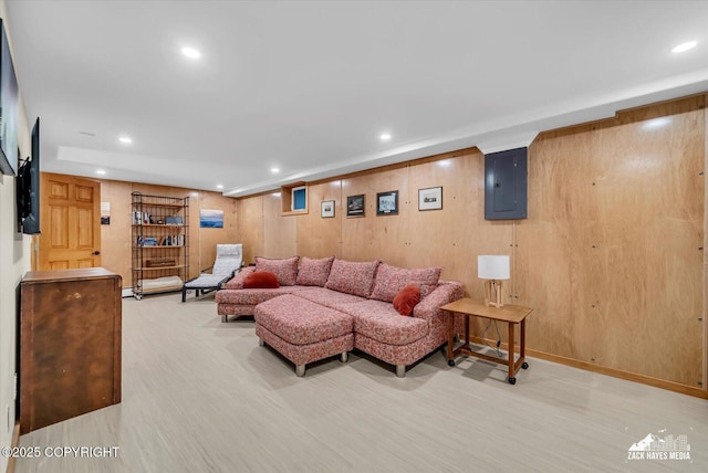 1601 Bannister Dr, Anchorage, AK 99508 - living room featuring electric panel, recessed lighting, light wood finished floors, and wooden walls