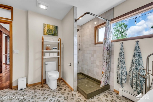 1601 Bannister Dr, Anchorage, AK 99508 - bathroom featuring toilet, a tile shower, a baseboard heating unit, and tile patterned floors