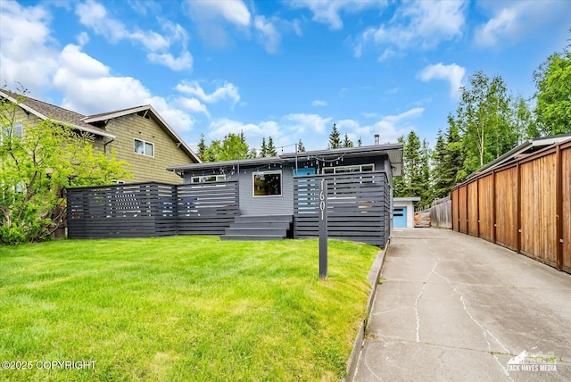 1601 Bannister Dr, Anchorage, AK 99508 - view of front of house with a front yard and a wooden deck