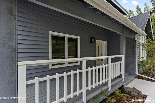 1701 Woo Blvd, Anchorage, AK 99515 - view of side of property with roof with shingles and covered porch