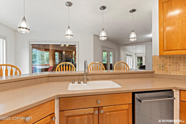 1701 Woo Blvd, Anchorage, AK 99515 - kitchen with a sink, decorative backsplash, light countertops, dishwasher, and decorative light fixtures