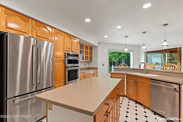 1701 Woo Blvd, Anchorage, AK 99515 - kitchen with stainless steel appliances, recessed lighting, a sink, a kitchen island, and light countertops
