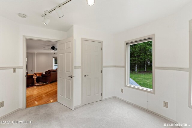 1701 Woo Blvd, Anchorage, AK 99515 - unfurnished bedroom with light colored carpet and rail lighting