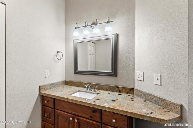 1701 Woo Blvd, Anchorage, AK 99515 - bathroom featuring vanity and a textured wall