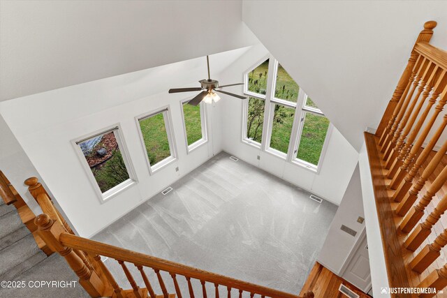 1701 Woo Blvd, Anchorage, AK 99515 - stairs with a towering ceiling, carpet flooring, and a ceiling fan