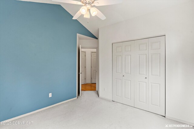 1701 Woo Blvd, Anchorage, AK 99515 - unfurnished bedroom featuring carpet, a closet, lofted ceiling, baseboards, and ceiling fan