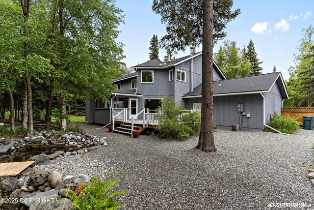 1701 Woo Blvd, Anchorage, AK 99515 - view of front of property with a deck and roof with shingles