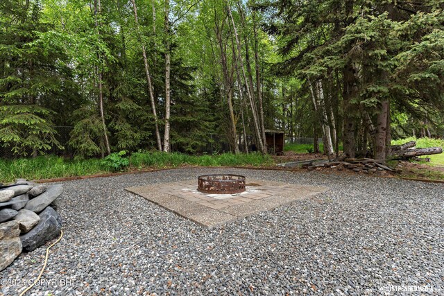1701 Woo Blvd, Anchorage, AK 99515 - view of yard featuring a fire pit