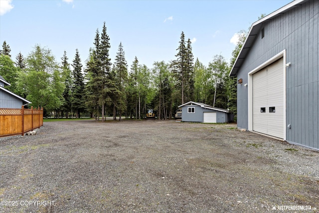 1701 Woo Blvd, Anchorage, AK 99515 - view of yard with an outdoor structure and a garage