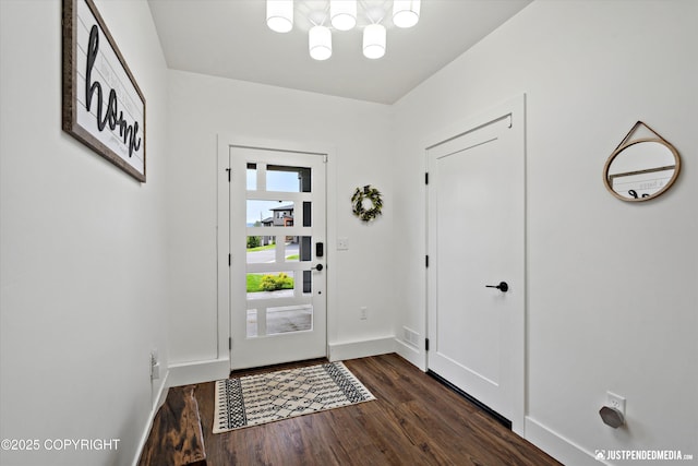 7864 Crane Cir, Anchorage, AK 99502 - entryway featuring a chandelier and dark wood-style floors