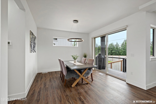 7864 Crane Cir, Anchorage, AK 99502 - dining room featuring wood finished floors and a chandelier