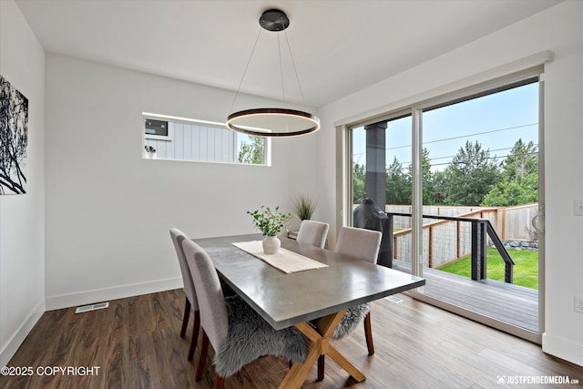 7864 Crane Cir, Anchorage, AK 99502 - dining area with plenty of natural light and wood finished floors