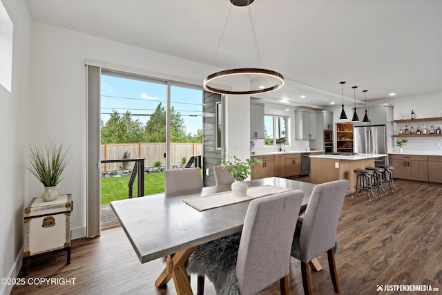 7864 Crane Cir, Anchorage, AK 99502 - dining room featuring dark wood-style floors and recessed lighting