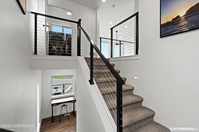 7864 Crane Cir, Anchorage, AK 99502 - stairway with healthy amount of natural light, wood finished floors, and recessed lighting