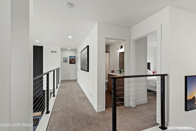 7864 Crane Cir, Anchorage, AK 99502 - hall featuring an upstairs landing, carpet flooring, and recessed lighting