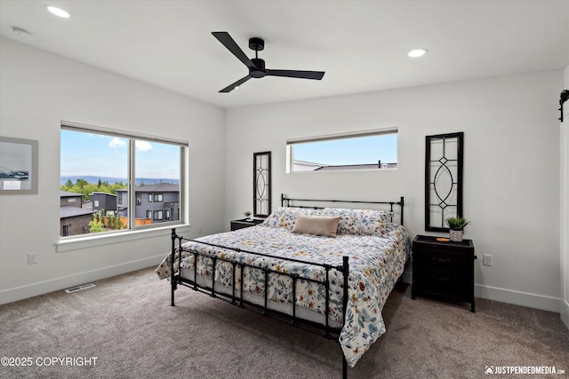 7864 Crane Cir, Anchorage, AK 99502 - bedroom with multiple windows, carpet, recessed lighting, and a ceiling fan