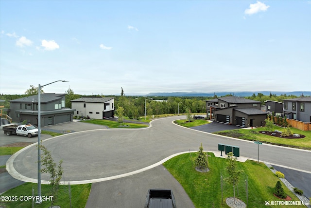 7864 Crane Cir, Anchorage, AK 99502 - view of asphalt road with a residential view and street lighting