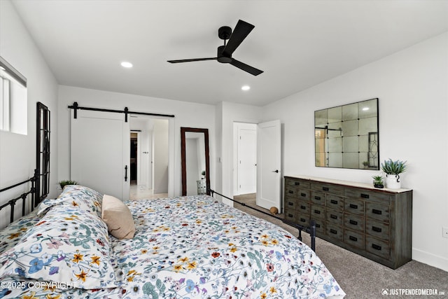 7864 Crane Cir, Anchorage, AK 99502 - bedroom featuring a barn door, carpet flooring, recessed lighting, and a ceiling fan