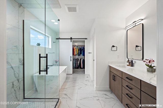 7864 Crane Cir, Anchorage, AK 99502 - bathroom featuring vanity, a spacious closet, a shower stall, marble finish floors, and a soaking tub
