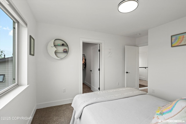 7864 Crane Cir, Anchorage, AK 99502 - bedroom with carpet flooring and a walk in closet