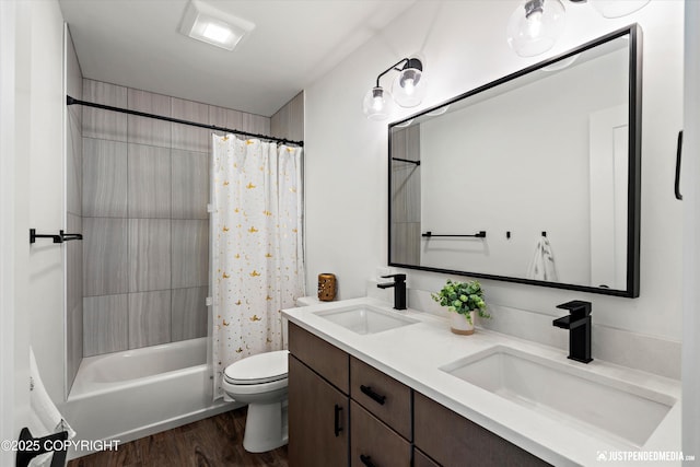7864 Crane Cir, Anchorage, AK 99502 - full bath featuring double vanity, wood finished floors, and shower / tub combo with curtain