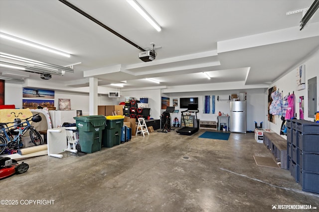 7864 Crane Cir, Anchorage, AK 99502 - garage with refrigerator, a garage door opener, an AC wall unit, and electric panel