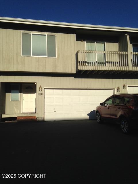 17491 Fire Eagle Way # 6, Eagle River, AK 99577 - multi unit property with an attached garage and a balcony