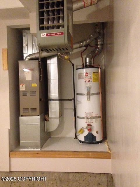 17491 Fire Eagle Way # 6, Eagle River, AK 99577 - utility room featuring water heater and a heating unit