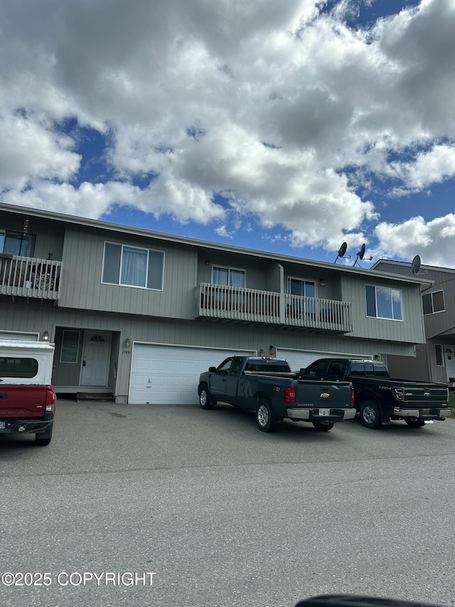 17491 Fire Eagle Way # 6, Eagle River, AK 99577 - view of property with an attached garage