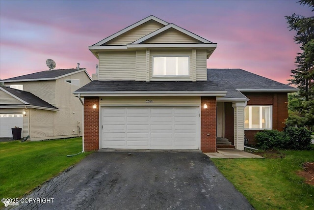 2350 Ariel Cir, Anchorage, AK 99515 - traditional home with asphalt driveway, brick siding, a garage, and a front lawn