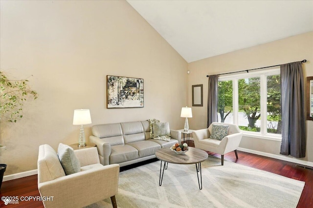 2350 Ariel Cir, Anchorage, AK 99515 - living room featuring wood finished floors, baseboards, and high vaulted ceiling