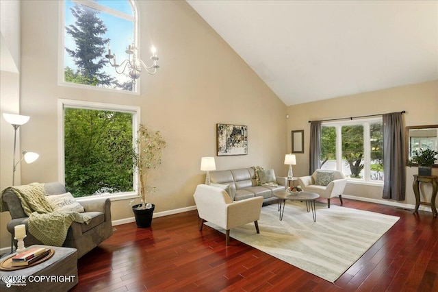 2350 Ariel Cir, Anchorage, AK 99515 - living room with high vaulted ceiling, baseboards, wood finished floors, and a chandelier