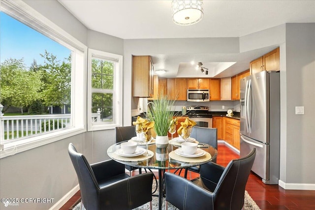 2350 Ariel Cir, Anchorage, AK 99515 - dining room featuring baseboards and dark wood finished floors