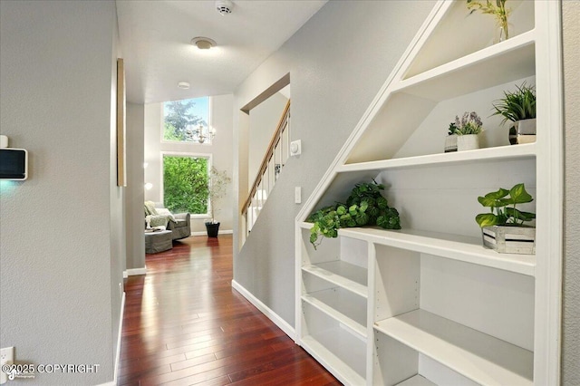 2350 Ariel Cir, Anchorage, AK 99515 - hallway featuring dark wood-style floors, stairway, and baseboards