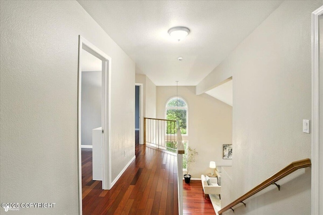 2350 Ariel Cir, Anchorage, AK 99515 - hall featuring an upstairs landing, dark wood-type flooring, baseboards, and lofted ceiling