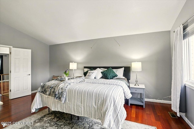 2350 Ariel Cir, Anchorage, AK 99515 - bedroom with vaulted ceiling, wood finished floors, and baseboards