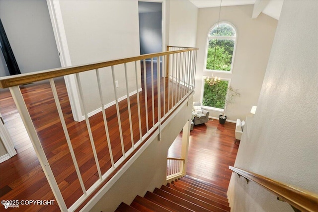 2350 Ariel Cir, Anchorage, AK 99515 - stairs featuring hardwood / wood-style flooring, baseboards, and a chandelier